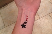 Red and black star tattoo